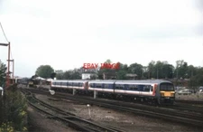 PHOTO  CLASS 456 456016 WITH A CLASSMATE PASSING BASINGSTOKE IN MAY 1991