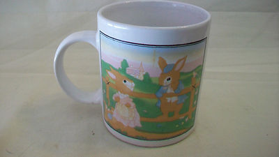 TWO RABBITS SITTING ON A FENCE CERAMIC COFFEE MUG