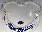 White plate with colorful Mickey Mouse outline, “Happy Birthday!” text, and USA map design on a patterned background.