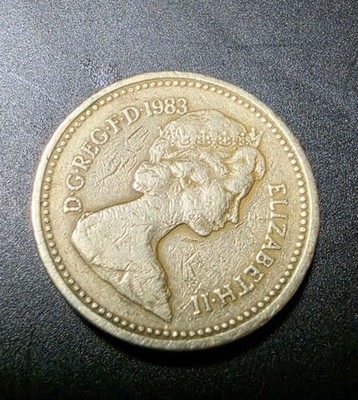 1983 Queen Elizabeth II One Pound coin upside-down rim error first year minted 