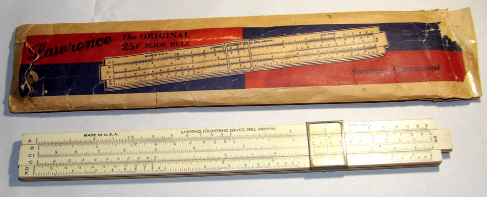 A genuine 1940s wooden slide rule in its original paper sheath — a tactile relic from the pre-calculator era that doubles as a desk conversation piece.