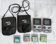 Two Nintendo Game Boy Color Atomic Purple w/ Carrier Cases and Games