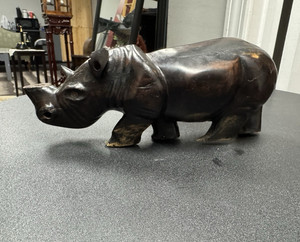 Hand-carved ebony wood rhinoceros sculpture, possibly of vintage African origin