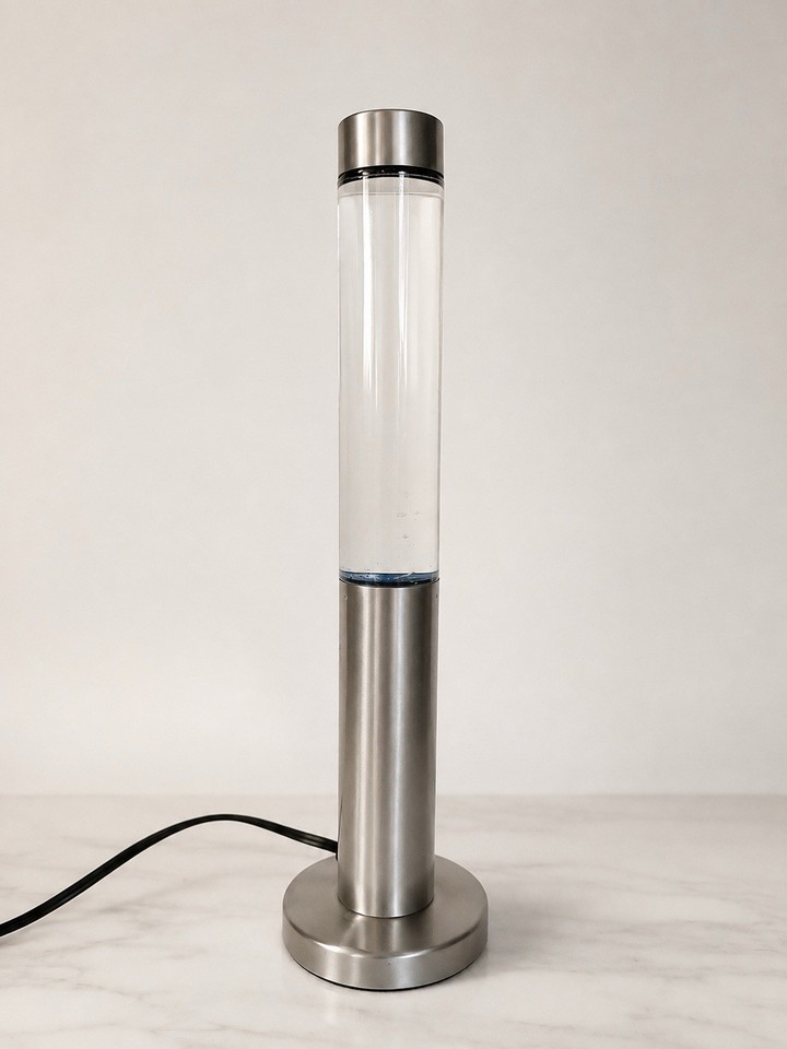 Y2K blue glitter lava lamp with silver base — the kind of rare find that defines a vibe era and is nearly impossible to track down intact.