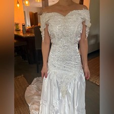 Beautifully embroidered wedding gown. Altered size 6