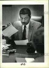 1984 Press Photo Sheriff Richard E. Artison checking reports in his office