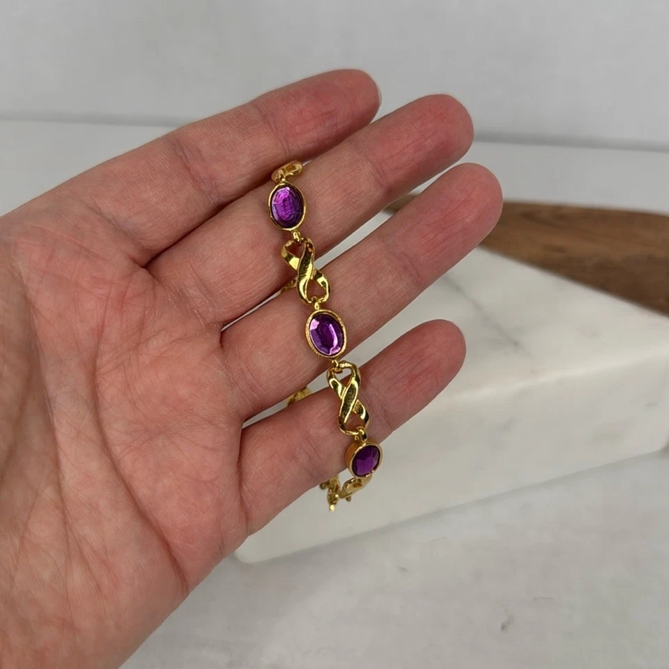 Pulsera para mujer Avon oro y morado Foto 3 de 4