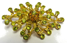 Vintage Atomic Star Burst Brooch Pin Peridot Green Rhinestone Goldtone 1960s