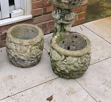 A Pair of Matching Cast Concrete Garden Planters with flower design weathered 