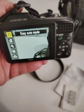 Nikon Coolpix L100 + Carry Strap, 15x Optical Zoom/Wide, 10 Megapixels, Black