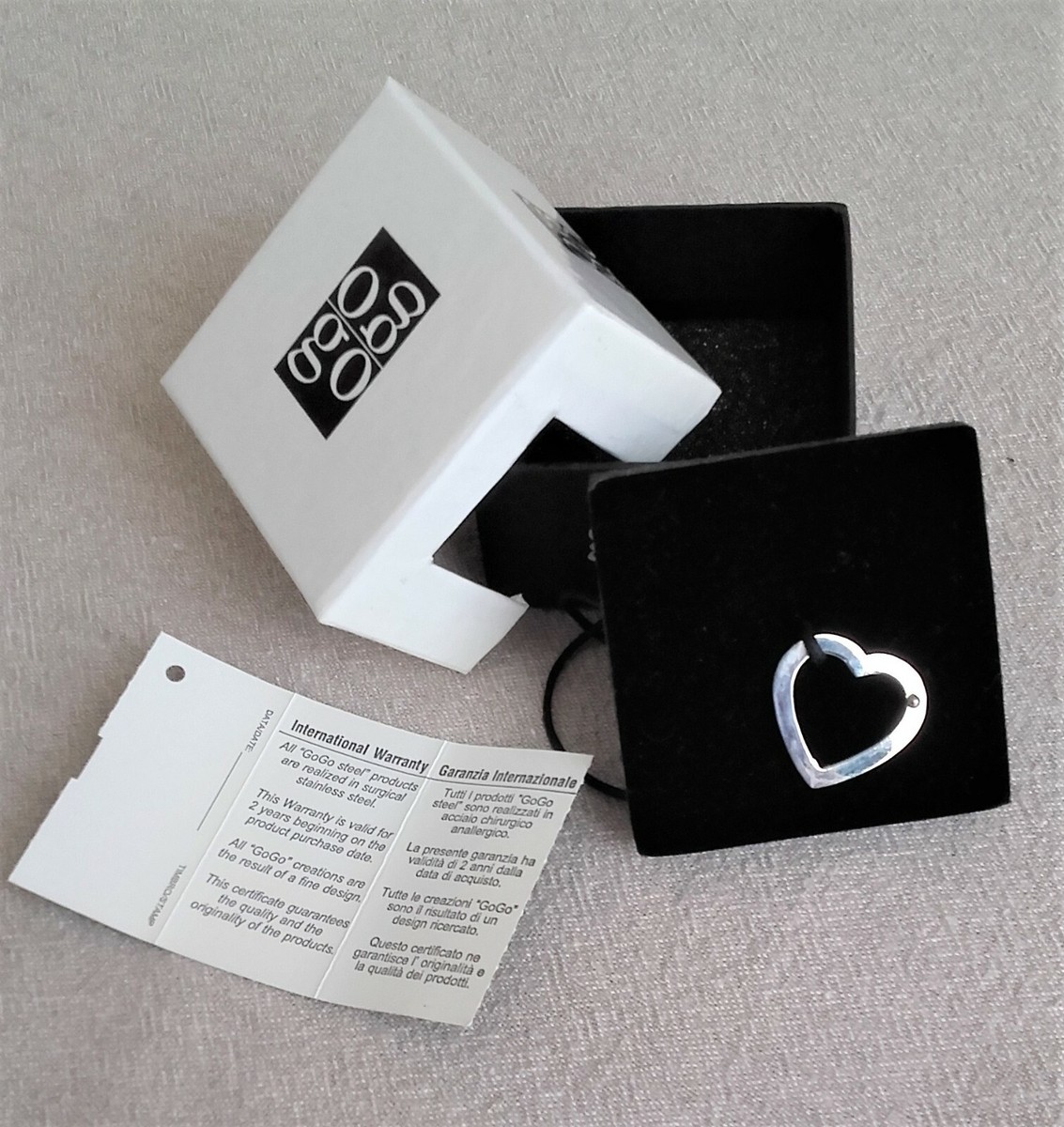 Ciondolo GOGO cuore in acciaio e punto in oro con corda