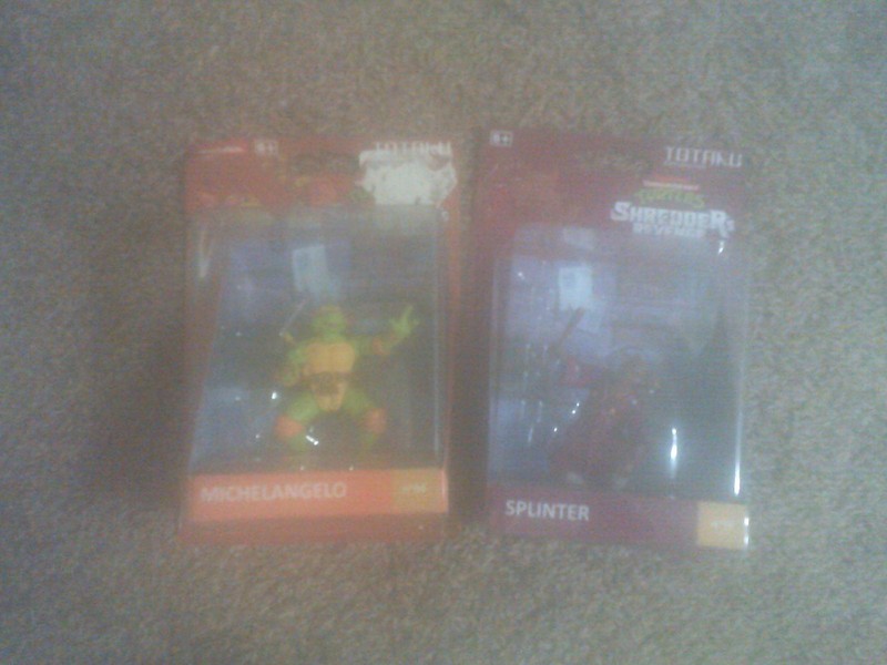 michelangelo & shredder figurines.
