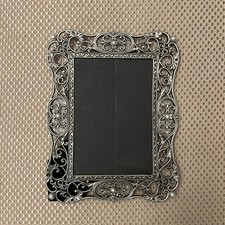 Beautiful metal picture frame with glass inserts and pearl like design