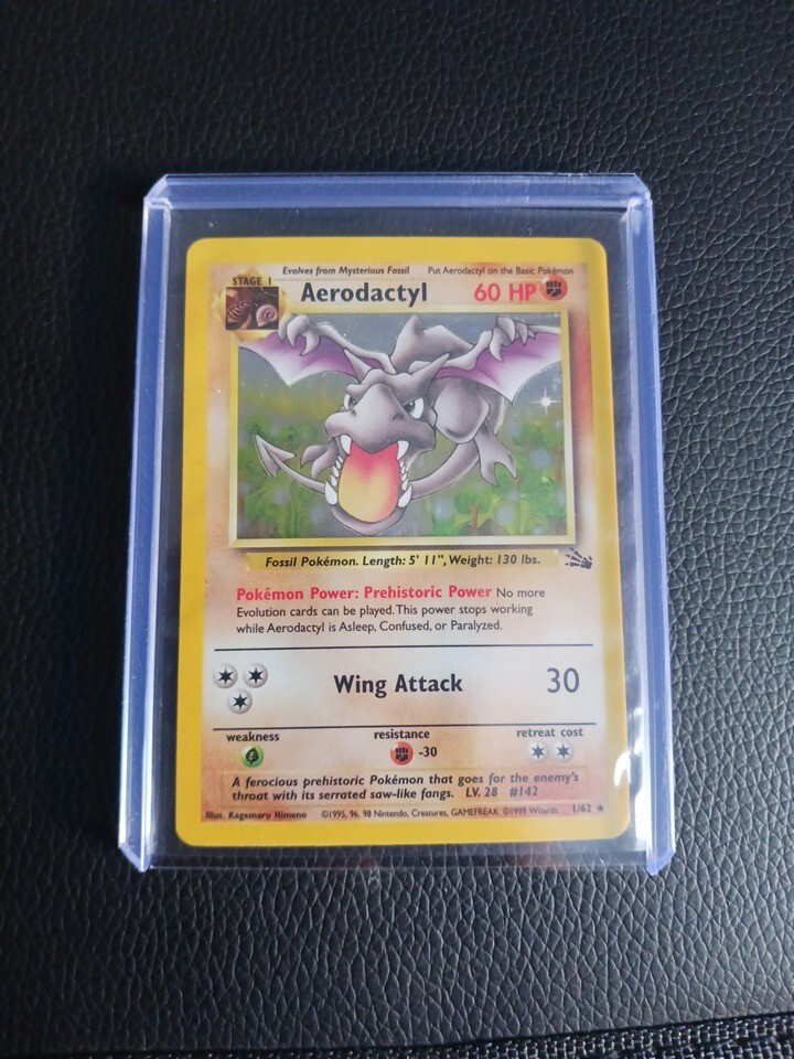 holographic aerodactyl pokemon card value 142/165 - Old Amber - 151 - Evolution Set Preserved in a tamper 1999 Aerodactyl 1st Edition Pre-release