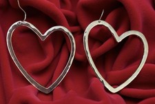Sterling silver heart-shaped hoop earrings