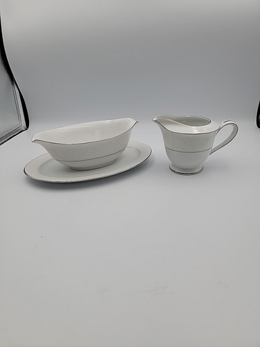 gravy boat with an attached underplate and a creamer from the Sango Fresco #3540
