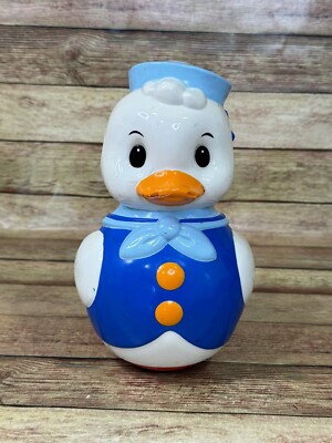 Vintage Roly-Poly duck. Soviet musical doll. Cracked Beak