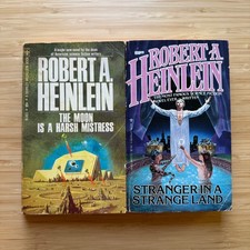 LOT The Moon is a Harsh Mistress Stranger in a Strange Land Robert A Heinlein PB LOT The Moon is a Harsh Mistress Stranger in a Strange Land Robert A Heinlein PB