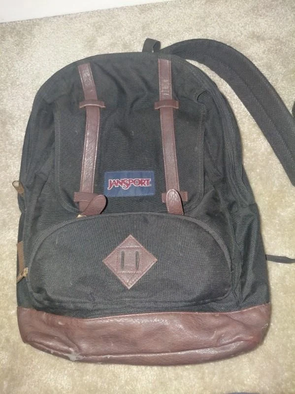 Mochila Jansport negra con cuero marrón Foto 2 de 4