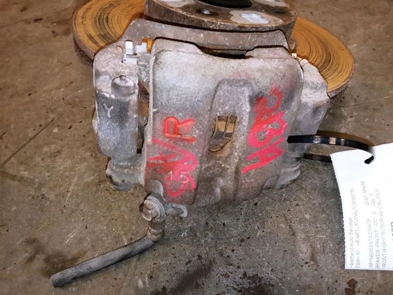 Rotor de freno delantero derecho pasajero Mazda Miata 2001 con pinza 10" fabricante original usado Foto 2 de 4