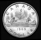 1963 $1 silver coin that looks great in a paper flip. Gorgeous