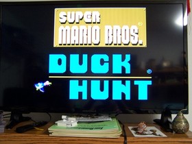 Nintendo NES Super Mario Bros Duck Hunt Game Bundle with Zapper Gun and Sleeve