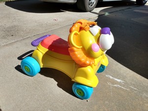 fisher price lion walker and ride on