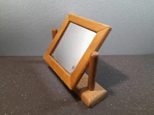 primitive small mirror made of wood
