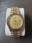 Seiko Quartz Gold Tone Men's Analog Wristwatch with Date Indicator VINTAGE