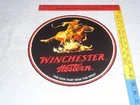 VINTAGE NOS WINCHESTER WESTERN HORSE MAN GUN 11 3/4 PORCELAIN METAL HUNTING SIGN