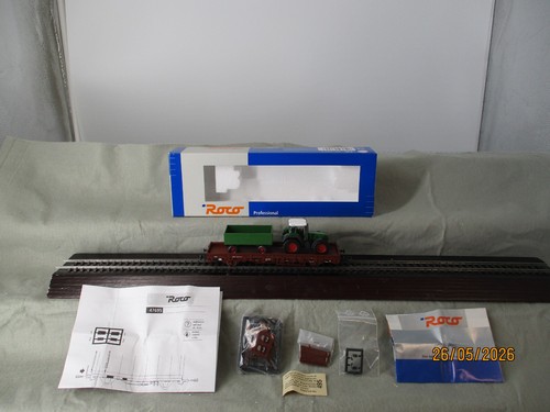 Roco Spur H0 47695 Rungenwagen Kbs mit Ladung Traktor der DB in OVP | Zustand: Gebraucht