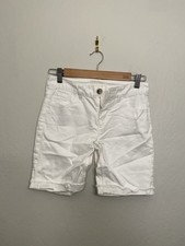 Justice:Girls white bermuda shorts,4 pockets,roll leg,belt loops. Size 12