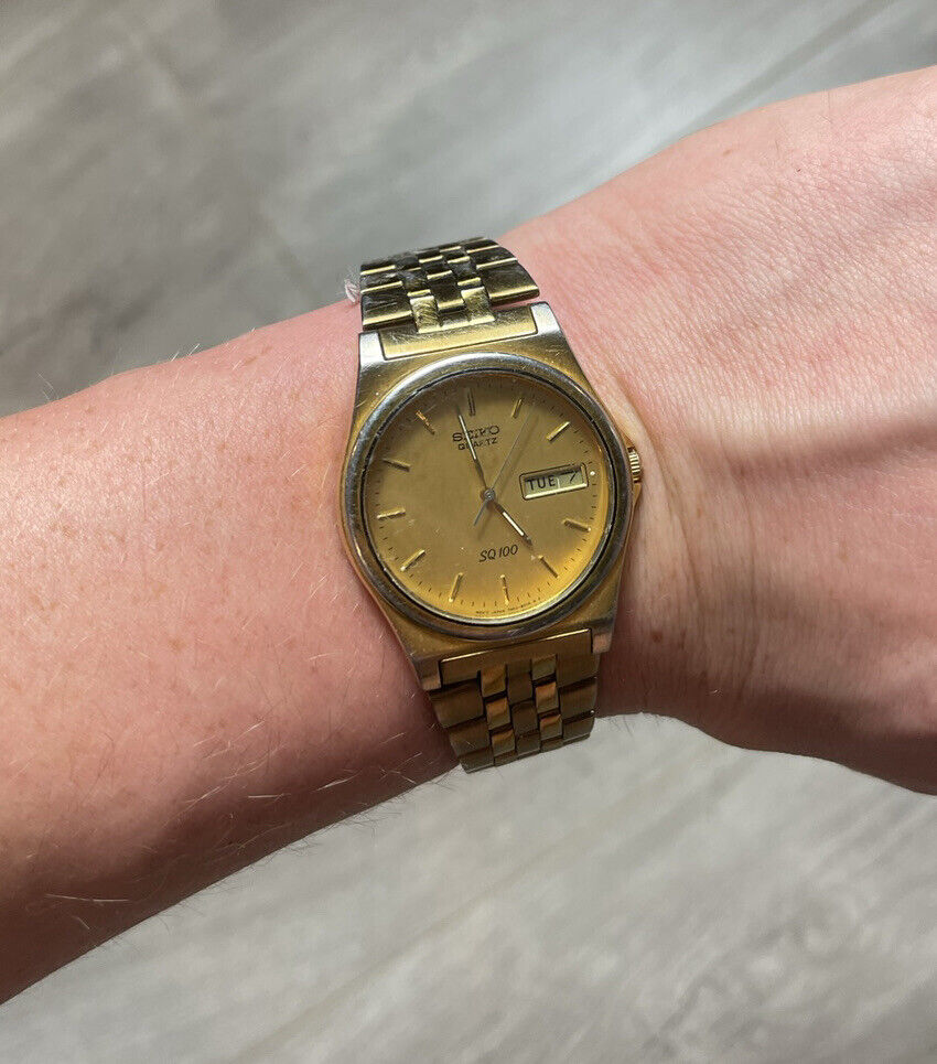 VINTAGE SEIKO QUARTZ SQ100 DATE CALENDAR WATCH Gold - Needs VINTAGE SEIKO QUARTZ SQ100 DATE CALENDAR WATCH Gold - Needs