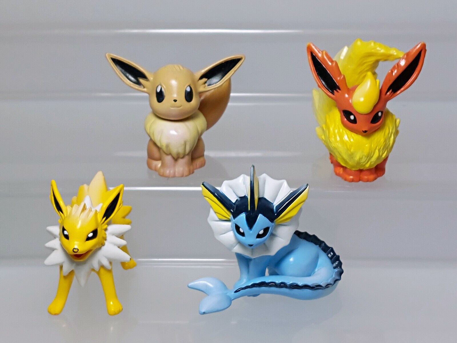 Figuras De Ação Pokémon Eevee, Jolteon, Vaporeon e Flareon