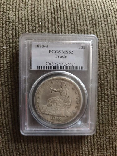 1878-CC LABEL shows 1878-S MS62 Trade Silver Dollar-label Doesn't Match Coin
