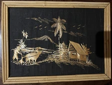 Handmade straw bamboo framed 1960s ox plowing field