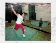 Press Photo Boy watches baseball pitcher throw indoors - lrs20191