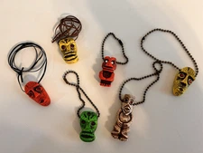 6 PCS. OF FLUORESCENT TIKI'S 3 HAVE KEY CHAINS  3 HAVE CORDS GLOW W/ BLACK LIGHT