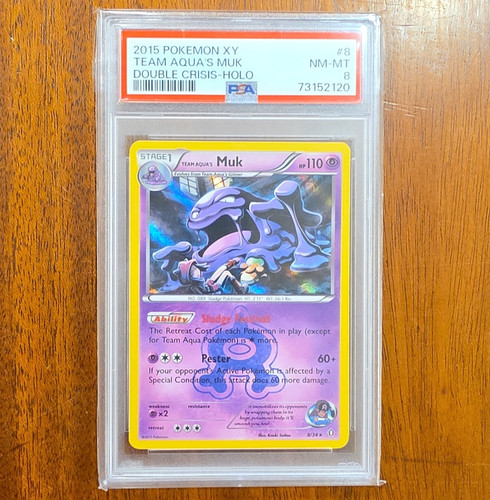 Team Aqua's Muk graded PSA 8 for sale on eBay