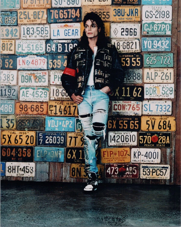 Michael Jackson iconic full length pose in torn jeans posing by