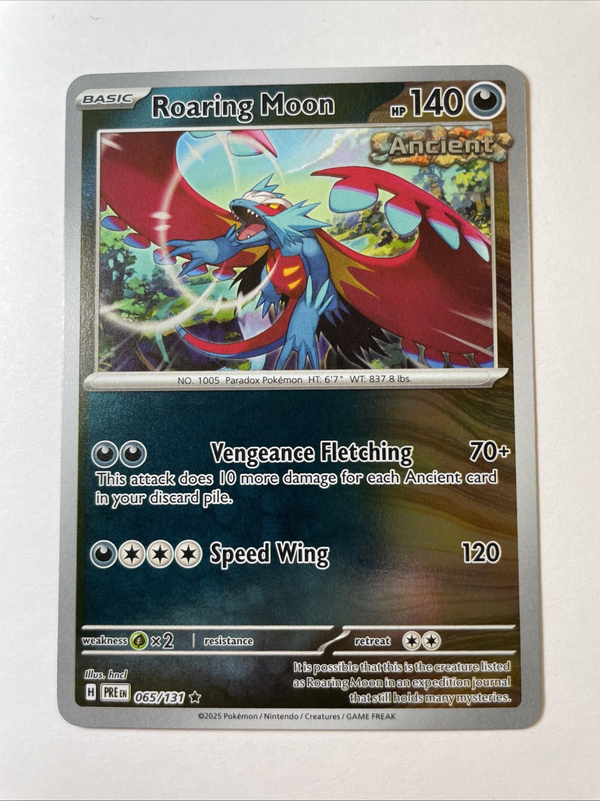 Roaring Moon 065/131 - Sv: Prismatic Evolutions Reverse Holo (NM)