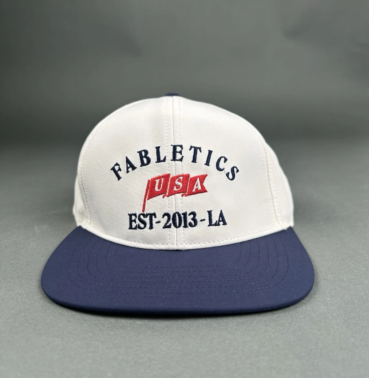 Fabletics Limited Edition USA Flag Bone White Navy SnapBack Trucker Hat NWT