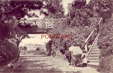 1908 England. THE RUSTIC BRIDGE, BOSCOMBE GARDENS - woman and a pram