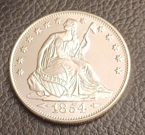 Highland Mint 1 0z troy .999 fine Silver Seated Liberty Round