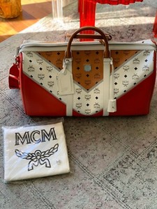 red mcm duffle bag