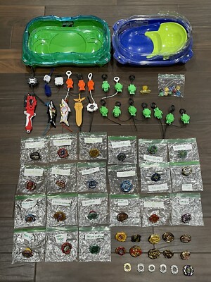 Lot of 31 Hasbro Tomy Beyblades  w/ 2 Stadiums, Launchers And Spare Parts