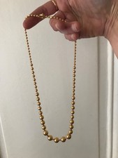 Superbe collier en chute de perles en plaque or 18k