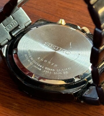 Seiko Men's 7T62-0CJ0 Quartz Chronograph Black Titanium + Gold