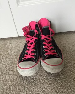 black and pink converse high tops