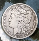1899 O Morgan Silver Dollar - 1 ea - 90 % Pure Silver- Very Good - In Capsule -
